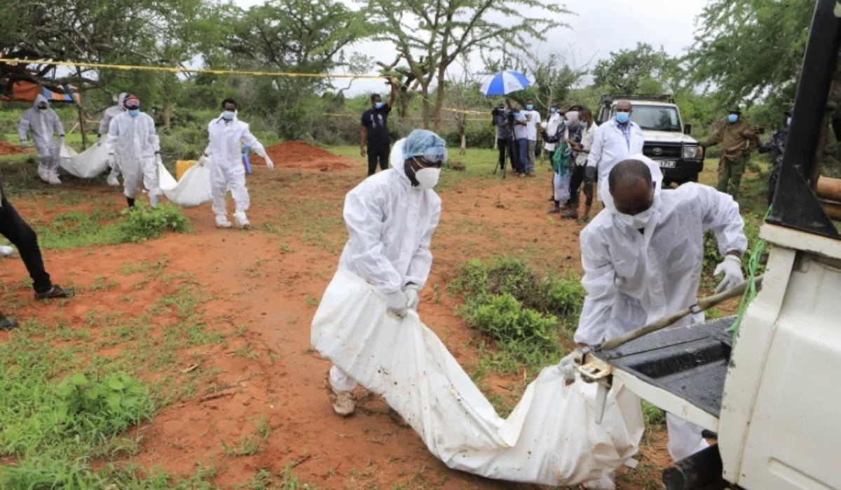 Forensic experts and homicide detectives carry the bodies of suspected members of a Christian cult named as Good News International Church (Courtesy Photo)