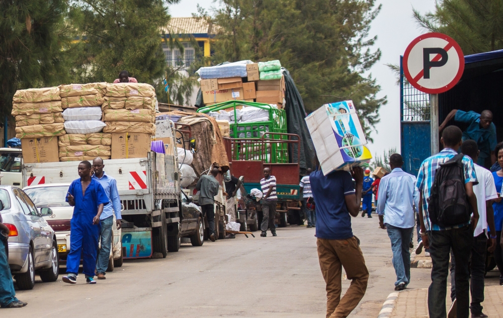 Workers load different commodities at Kigali City’s business district for upcountry supply. The new
tax reforms will reduce the tax burden on both business people and workers. Photo by Craish Bahizi