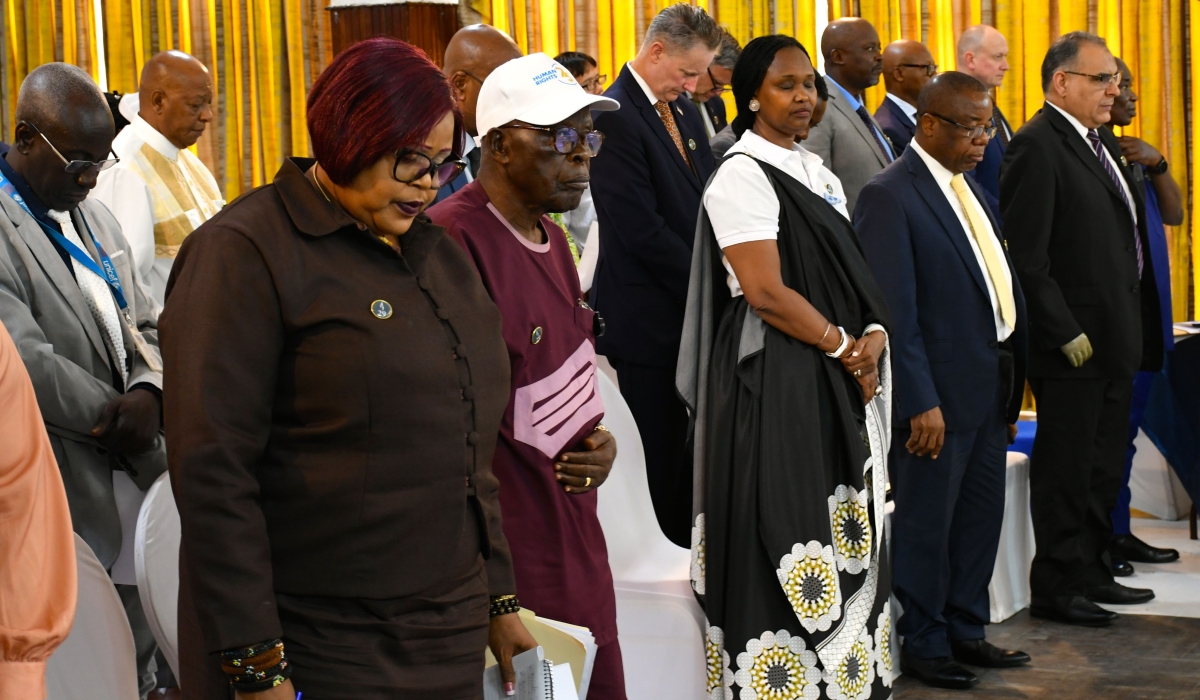 Participants observe a minute of silence in remembrance of the victims of the 1994 genocide against Tutsi