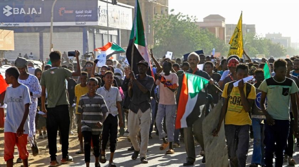 Sudanese protesters take part in a demonstration in southern Khartoum on April 6, (AFP)