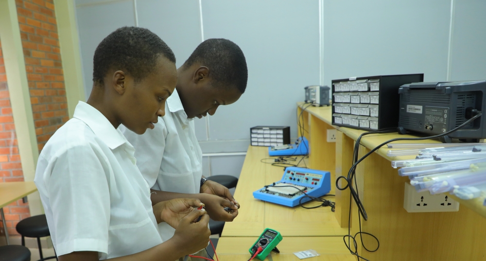 High school students practicing technology related to electrical, engineering, and computer science during the visit to the University of Rwanda  Photo by Craish Bahizi