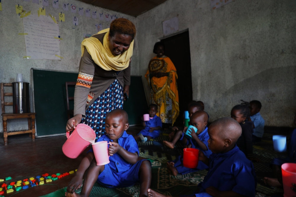 Children take porridge at the home-based ECD centre in Kabyaza village, in Nyabihu District. File photos