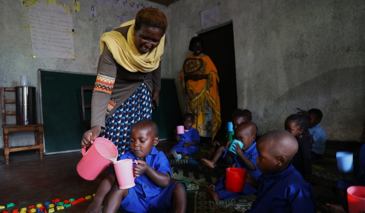 Children take porridge at the home-based ECD centre in Kabyaza village, in Nyabihu District. File photos