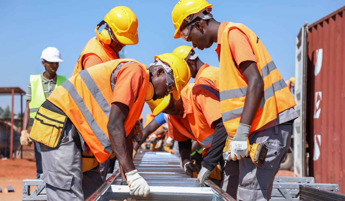 Workers operating during the construction of Bwiza estate. Rwandan Socialist Labour Party requested the government to urgently consider a way to increase the salaries of workers. Photo by Craish Bahizi 
