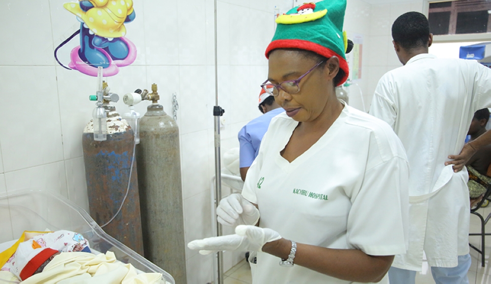 A nurse attends to a baby at Kacyiru Hospital on December 25, 2019. Rwanda Workers’ Trade Union Confederation requested the government to increase the salaries of nurses and reduce their working hours. Photo: Craish Bahizi.