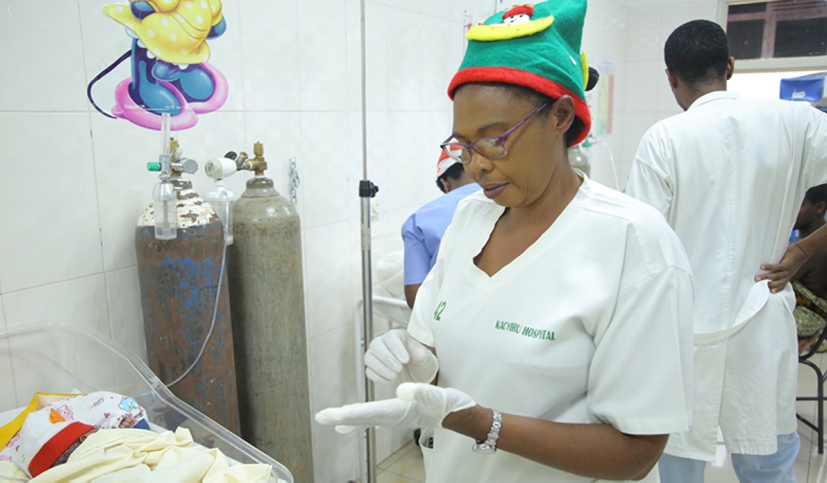 A nurse attends to a baby at Kacyiru Hospital on December 25, 2019. Rwanda Workers’ Trade Union Confederation requested the government to increase the salaries of nurses and reduce their working hours. Photo: Craish Bahizi.