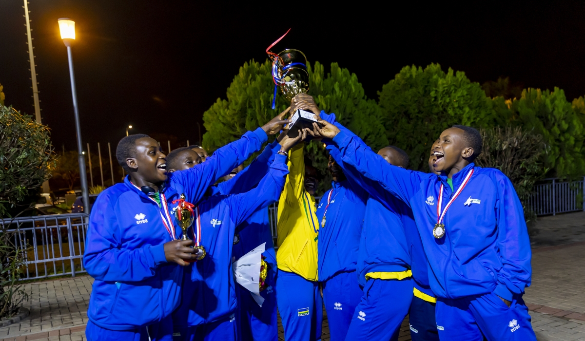 Rwanda U17 women&#039;s handball team celebrates the Zone 5 trophy upon arrival at Kigali International Airport on Monday night. Photo by Olivier Mugwiza