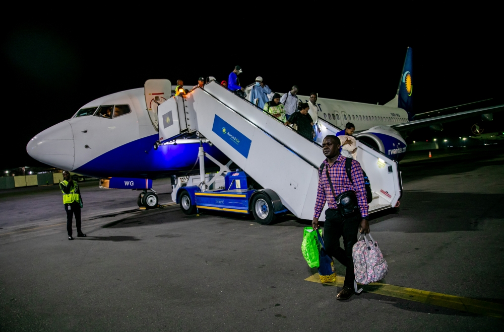 Daniel Ogendo, a Kenyan national, arrives at Kigali International Airport with his family on Tuesday, May 2.