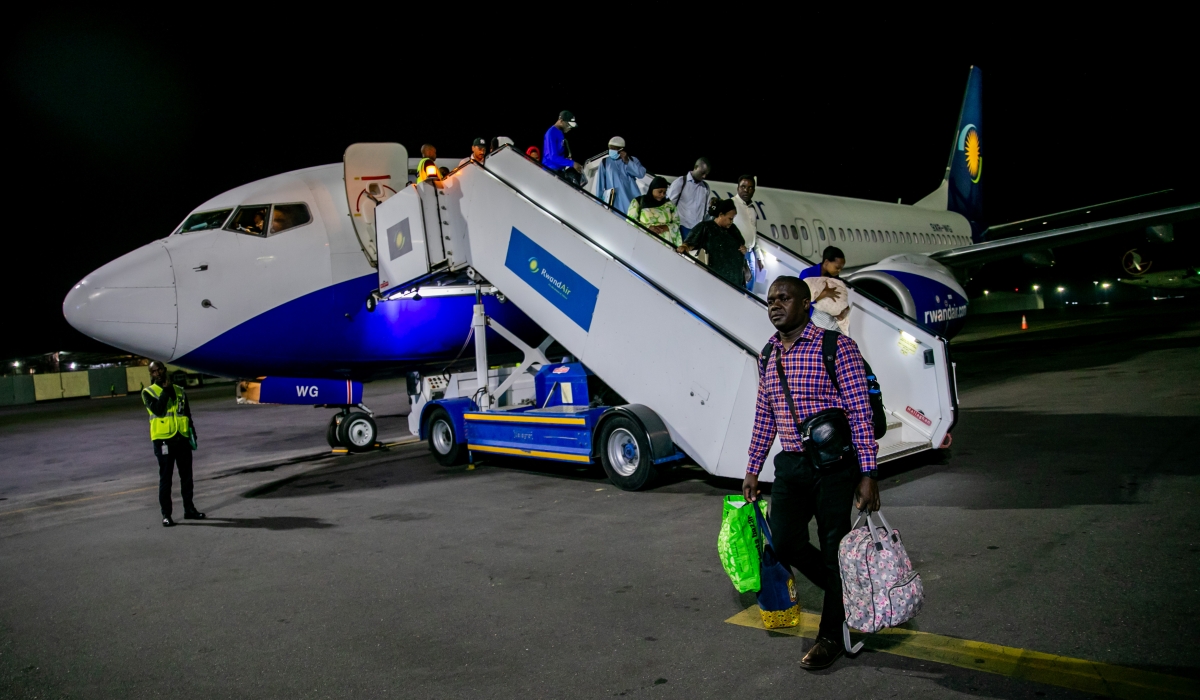 Daniel Ogendo, a Kenyan national, arrives at Kigali International Airport with his family on Tuesday, May 2.
