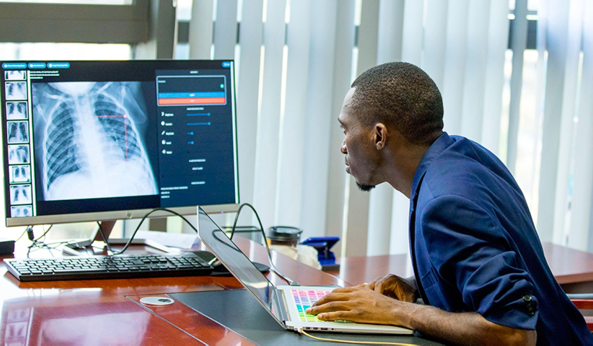 Audace Nakeshimana, the founder of Insightiv, a Rwandan startup, demonstrates how Artificial Intelligence algorithms can be used in automated
detection of Covid-19 from medical images in 2020. Photo: File.