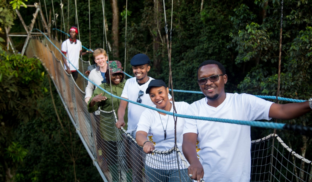 Some tourists on Nyungwe Forest&#039;s canopy walkway. Sam Ngendahimana
