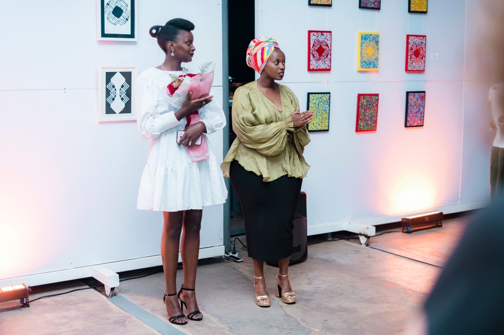 Jemima Kakizi with Crista Uwase during the opening of Irebe Ry&#039;Itangaza art exhibition.