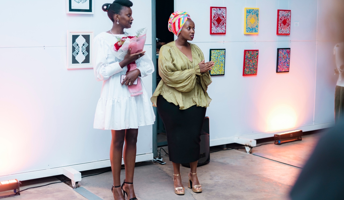 Jemima Kakizi with Crista Uwase during the opening of Irebe Ry&#039;Itangaza art exhibition.