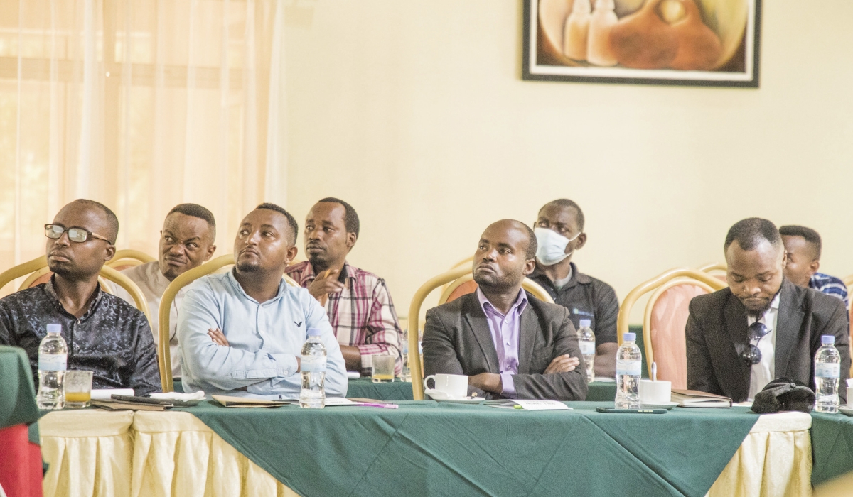 Participants follow a presentation during the training session. Photos: Emmanuel Dushimirimana.