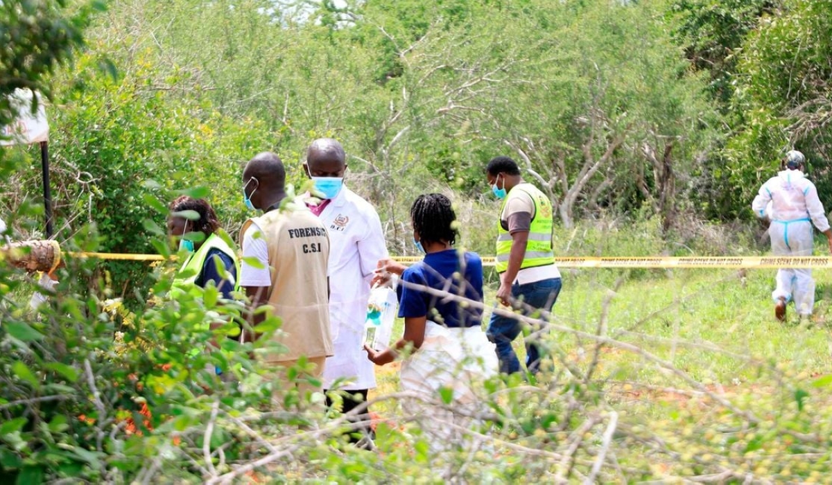 Kenyan security and forensic officers watch as more bodies are exhumed at the Shakahola forest on May 9. This is after more than 100 members of Good News International Church led by Kenyan Pastor Paul Mackenzie starved themselves to death after he predicted the world would end on April 15 and instructed his followers to kill themselves to be the first to go to heaven. Photo: NMG.