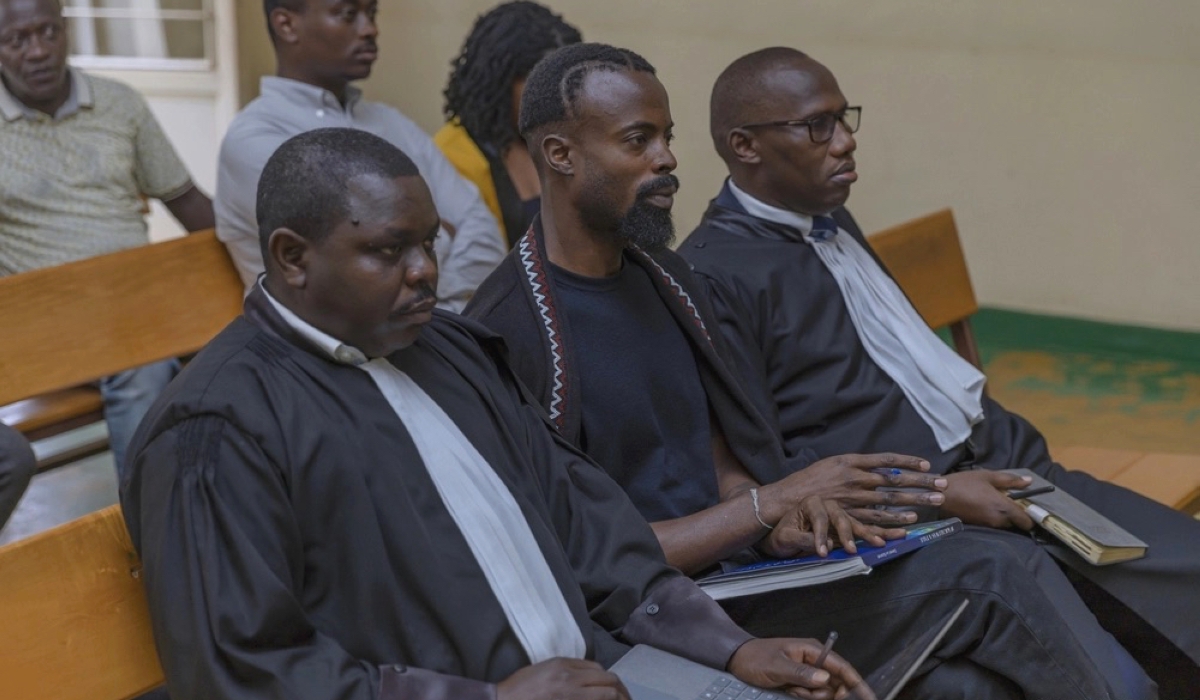 Moses Turahirwa with his legal counsel in court on May 10. Photo: Igihe.com