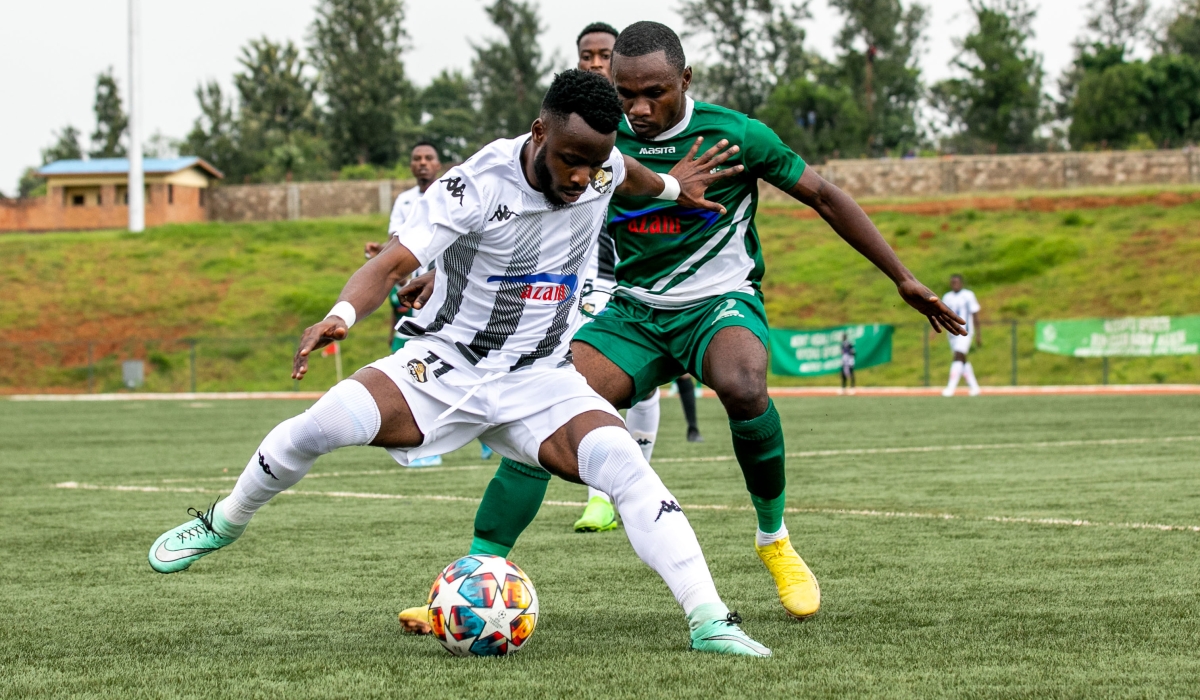 APR FC striker Gilbert Mugisha controls the ball against Kiyovu&#039;s player duringa 1-1 draw in Wednesday’s Peace Cup semi-final first leg encounter held at Bugesera stadium. Photo by Olivier Mugwiza