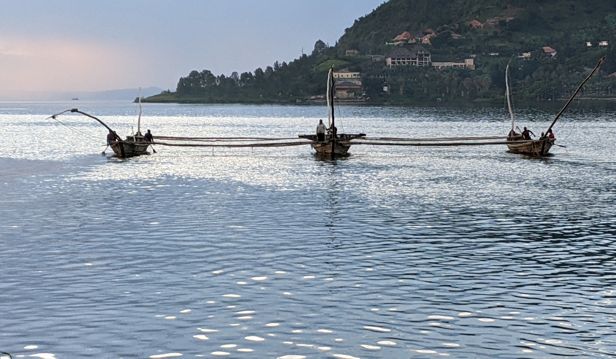 Fishermen in Lake Kivu head to fishing sites during evening hours. Photo: Germain Nsanzimana.