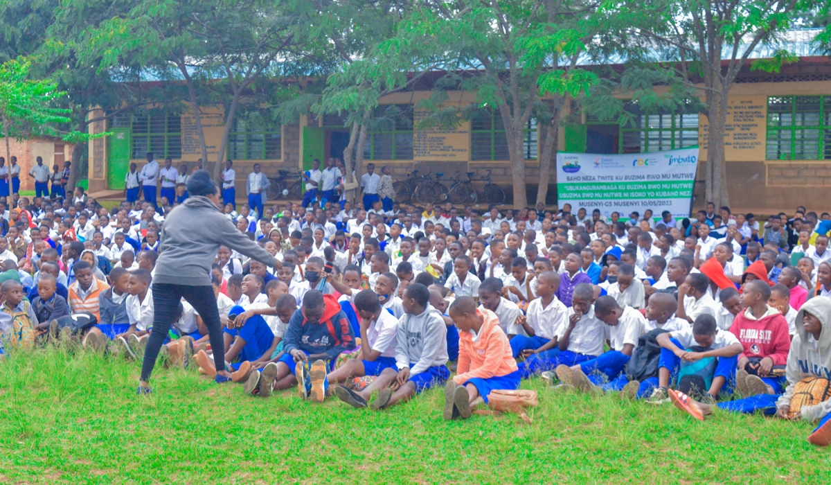 Anathalie Uwizeyimana, a Psychologist gives remarks to students at Musenyi Technical Secondary School (TSS) on mental health awareness.
