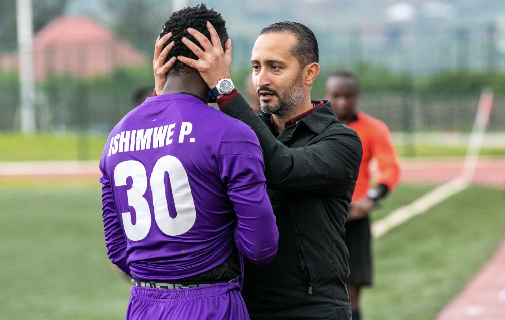 APR head coach Ben Moussa speaks to his goalkeeper Pierre Ishimwe after getting injury during the first leg match against Kiyovu at Bugesera Stadium. Photo by Olivier Mugwiza
