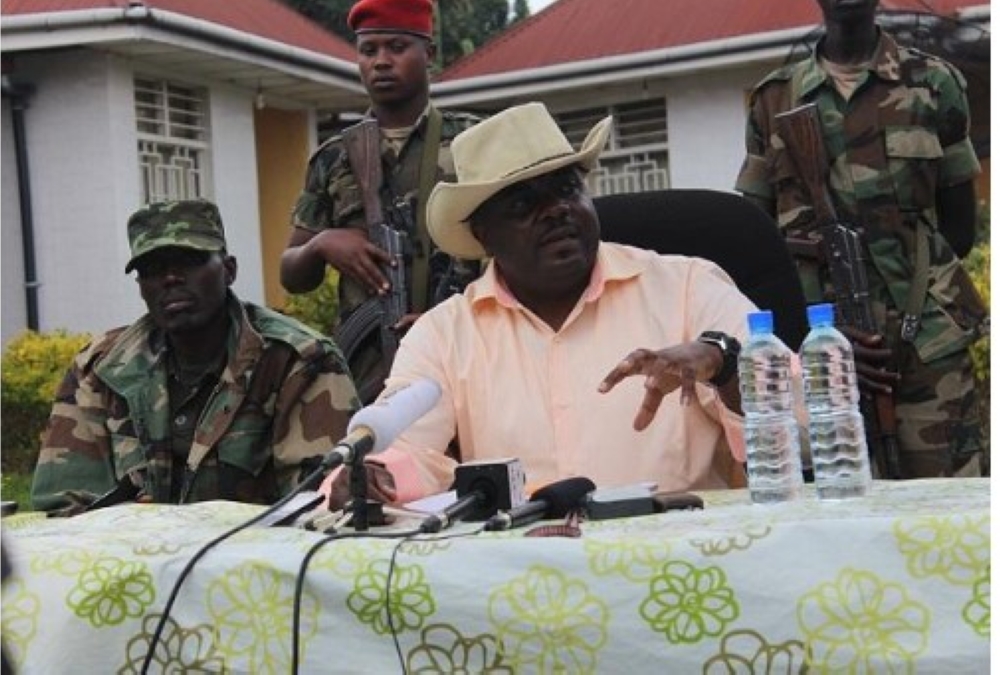 Bertrand Bisimwa, president of the M23 rebel group, addresses journalists in eastern DR Congo, as Gen Sultani Makenga, the group&#039;s military commander (left), looks on. Courtesy.