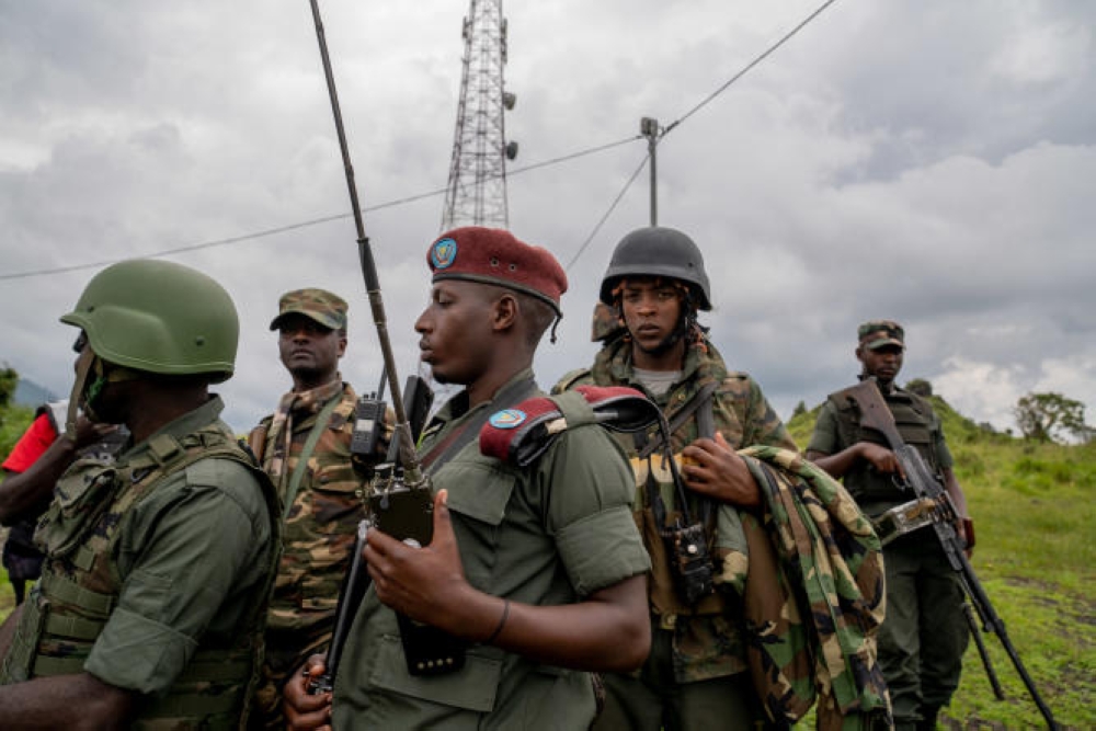 M23 rebels look on in Kibumba in eastern Democratic Republic of Congo, on December 23, 2022. (Photo by GLODY MURHABAZI / AFP)