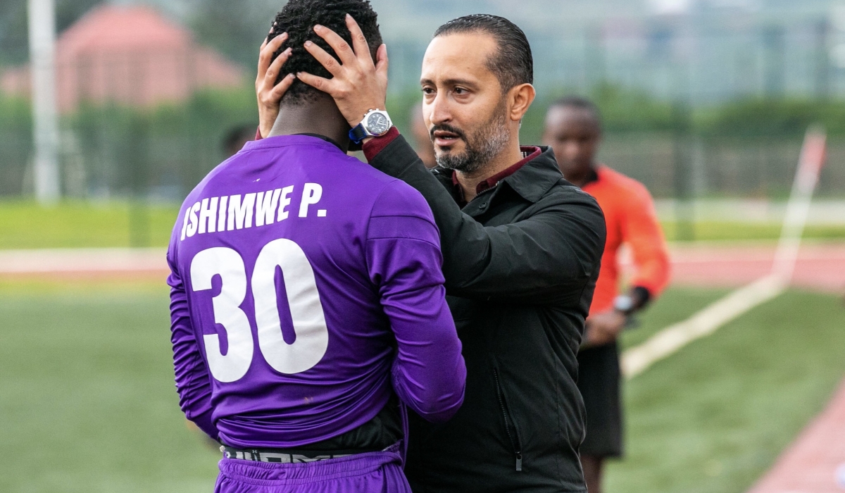 APR head coach Ben Moussa speaks to his goalkeeper Pierre Ishimwe after getting injury during the first leg match against Kiyovu at Bugesera Stadium. Photo by Olivier Mugwiza