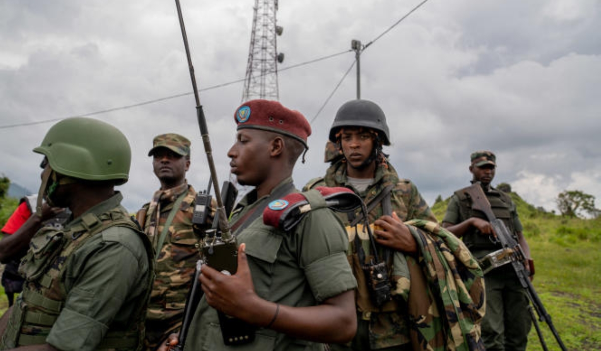 M23 rebels look on in Kibumba in eastern Democratic Republic of Congo, on December 23, 2022. (Photo by GLODY MURHABAZI / AFP)