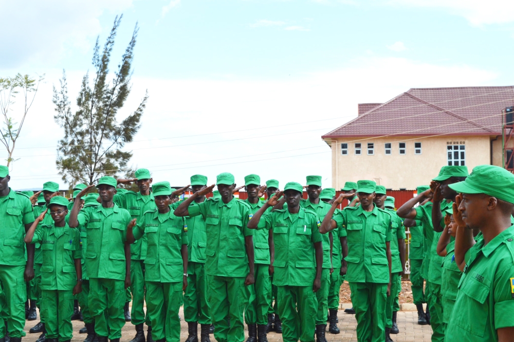 Members of  District Administration Security Support Organ (DASSO) officers during a parade. The government has announced new reforms to improve the performance of DASSO. Sam Ngendahimana