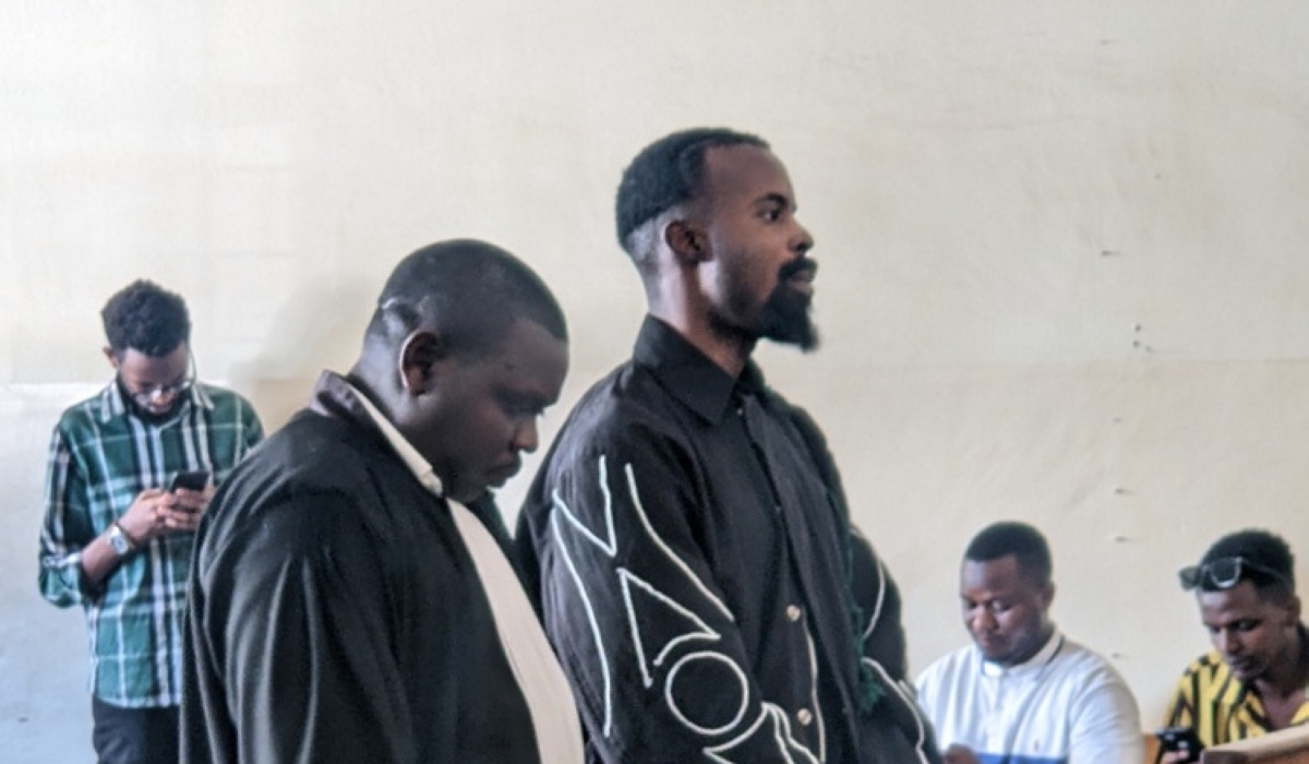 Moses Turahirwa with his lawyer in court on May 15. Photo: Igihe.com