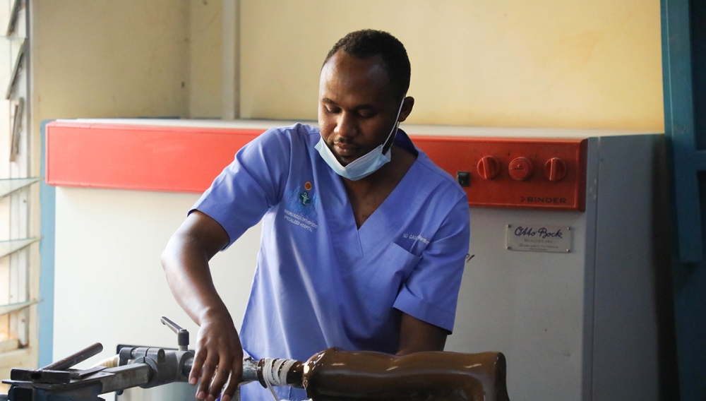 A medic fixes a prosthesis which is an artificial body part used to replace a damaged part for the affected person, at Inkuru nziza Hospital. Over Rwf7bn more needed to cover prostheses for people with disabilities. Bahizi