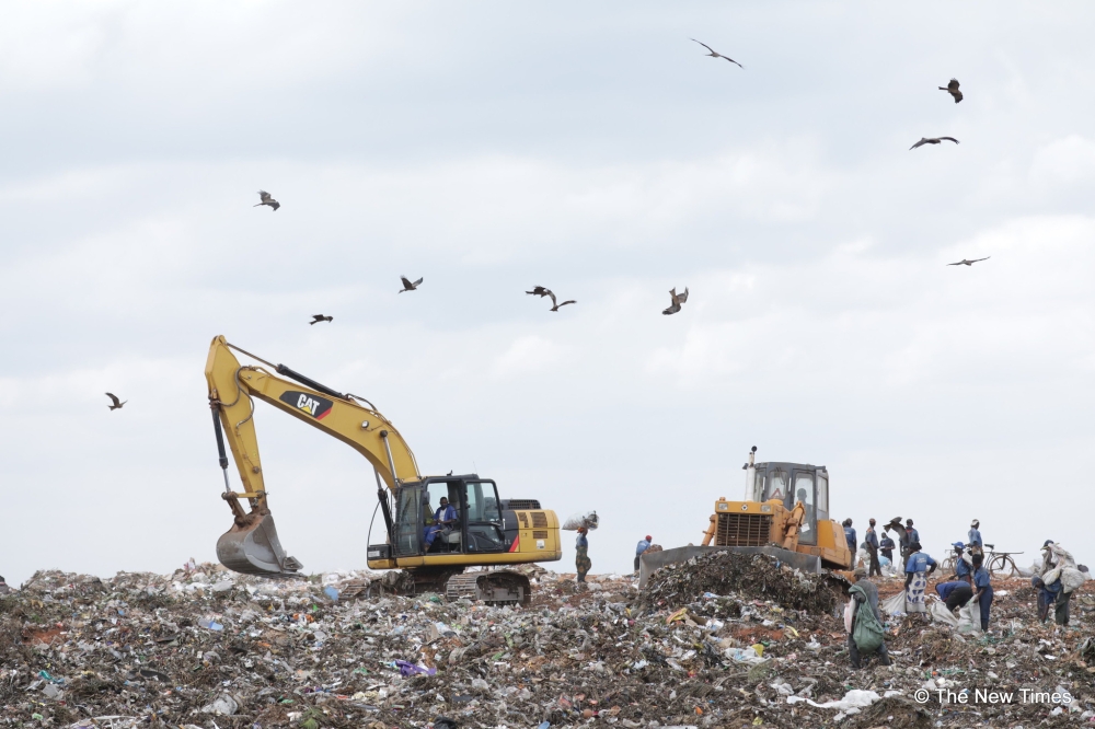 Workers sort garbage at Nduba landfill in Gasabo District. To date, over 520 properties in the buffer zone of Nduba Landfill have been expropriated since 2021.File