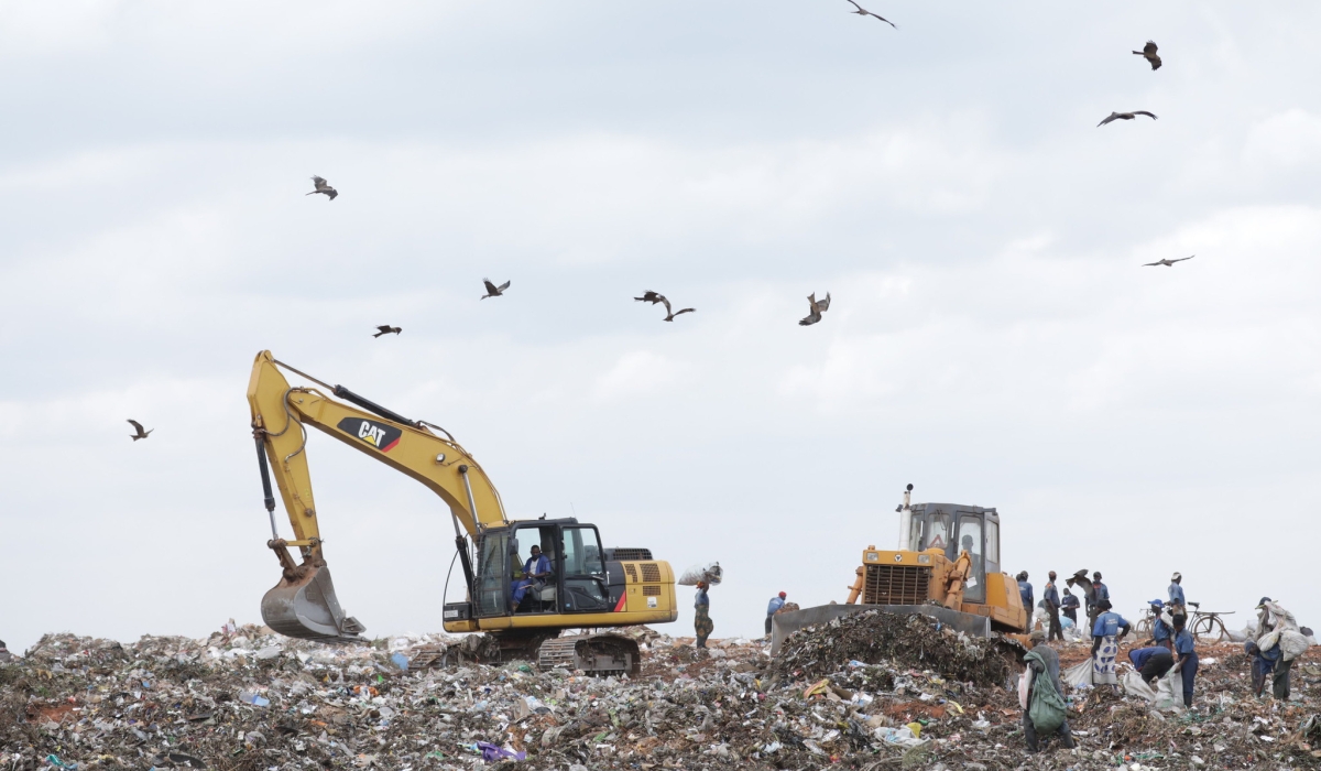 Workers sort garbage at Nduba landfill in Gasabo District. To date, over 520 properties in the buffer zone of Nduba Landfill have been expropriated since 2021.File