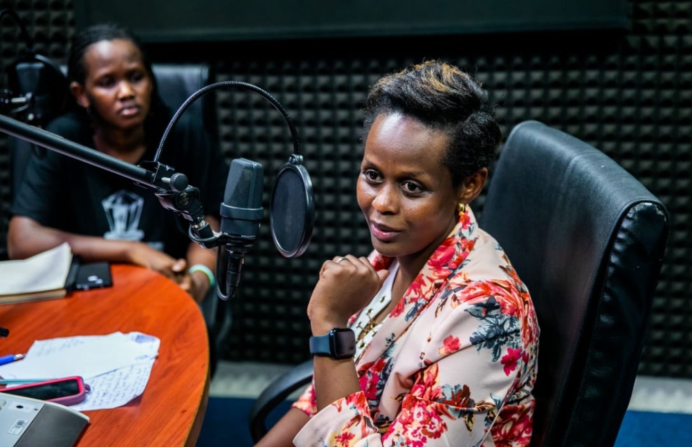 Sylvie Nsanga has made a name for herself as a feminist on Twitter. In the background is Glory Iribagiza, the Gender and Innovation Editor at The New Times.