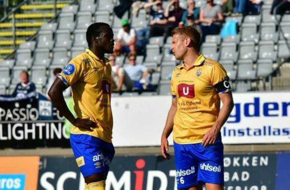 Rwandan International player Ange Mutsinzi who plays for FK Jerv chats with his teammate before shooting a free-kick. Courtesy