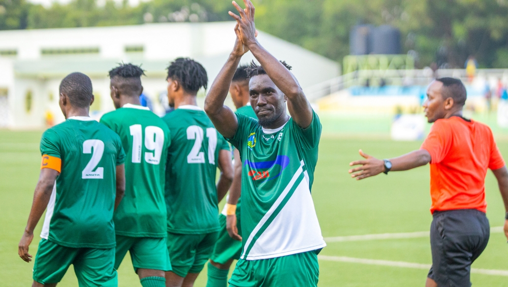 SC Kiyovu striker Erisa Ssekisambu applauds for the Green Baggies supporters after scoring a goal during  a league tie. The attacker Ssekisambu was left dejected after his penalty miss during Sunday’s 1-0 defeat to Sunrise