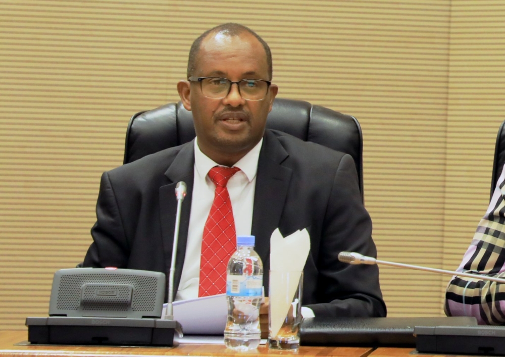 MP Theogene Munyangeyo, the Chairperson of the parliamentary  Committee on Economy and Trade addresses members of parliament on May 24. Courtesy