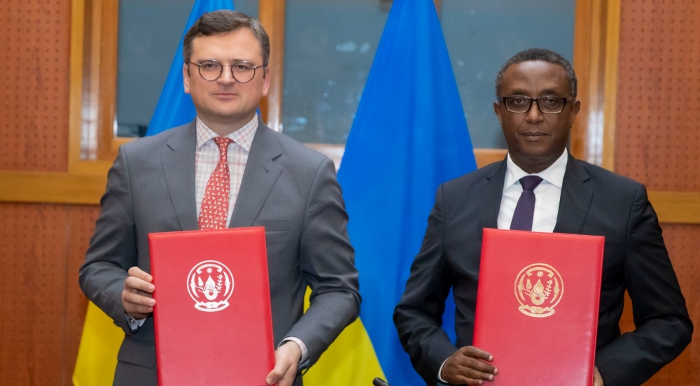 Minister of Foreign Affairs and International Cooperation, Dr Vincent Biruta and his  Ukrainian counterpart , Dmytro Kuleba, pose for a photo after signing an MoU on political consultations between the two countries, in Kigali on Thursday, May 25, 2023 (courtesy).