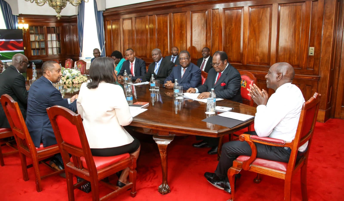 Kenyan President William Ruto (centre), in a group photo with EAC Cabinet Secretary Rebecca Miano (fourth right), and Justice Benjamin Odoki (third left) and other officials at State House, Nairobi, on May 25, 2023 