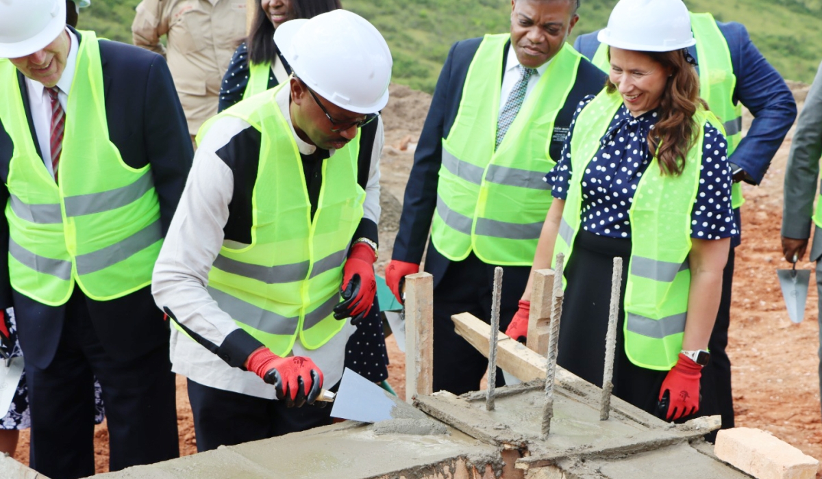 The Minister of Interior, Alfred Gasana, lays a foundation stone during the ground-breaking ceremony for the construction works on halfway houses in Rwamagana District, on Thursday, May 25. The new facility, expected to be completed by April 2024, will cost more than Rwf1 billion and host 2,000 male and 500 female inmates. Photo: Emmanuel Nkangura.