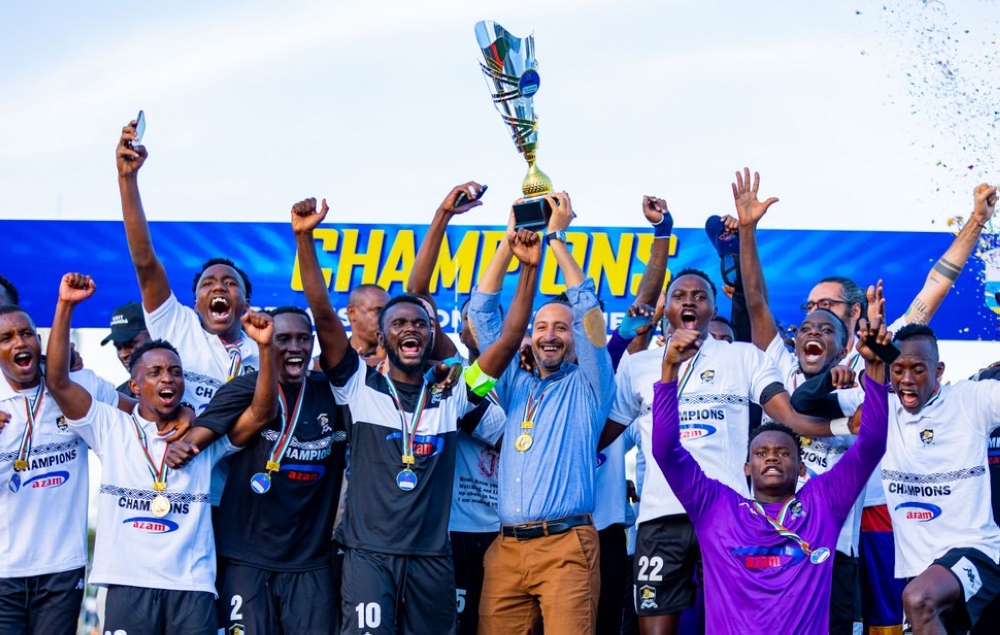 APR FC players and coaching staff celebrate with the trophy after being crowned Rwanda Premier League Champions at Kigali Pele Stadium on Sunday, May 28. The army side clinched their record 21st league title, their fourth in a row after beating Gorilla FC 2-1 and won the title by goal difference after finishing the league season campaign tied on 63 points with runners-up Kiyovu who beat Rutsiro FC 3-1 at Muhanga Stadium . Photos by Craish Bahizi