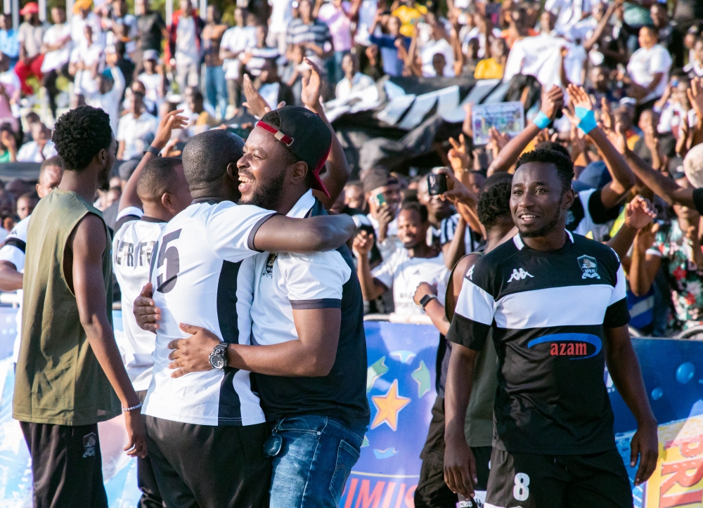 Players cheer with supporters after being crowned Rwanda National League Champions
