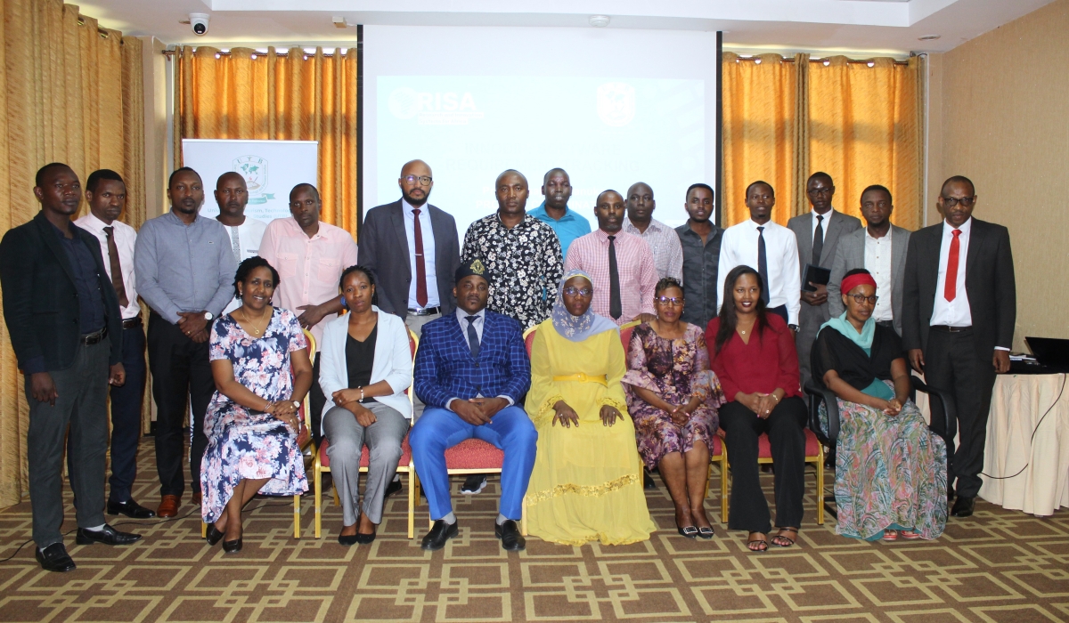 Delegates pose for a group photo after  presentiing their findings and devise effective solutions during a meeting on May 25 .Courtesy