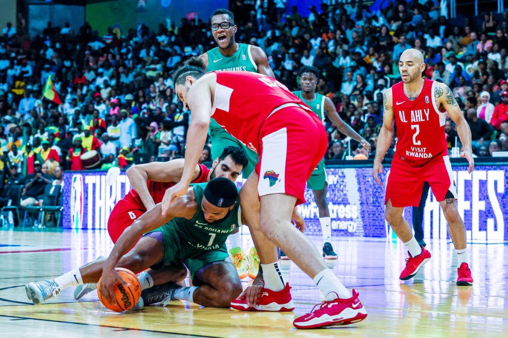 AS Douanes player battles for the ball with Al Ahly players during the final at BK Arena Al Ahly shocked AS Douanes  80- 65 to win the 2023 Basketball Africa League. Olivier Mugwiza
