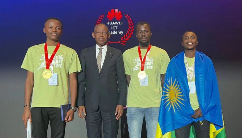Rwanda&#039;s envoy in China Amb James Kimonyo poses for a photo with the three UR students, Regis Minani, Magnifique Mugiraneza, and Michael Fred Mugisha who excelled at the 2023 Huawei ICT Competition. Courtesy