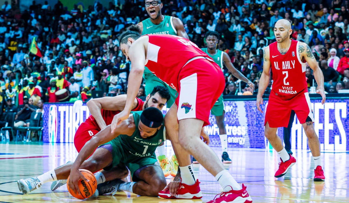 AS Douanes player battles for the ball with Al Ahly players during the final at BK Arena Al Ahly shocked AS Douanes  80- 65 to win the 2023 Basketball Africa League. Olivier Mugwiza