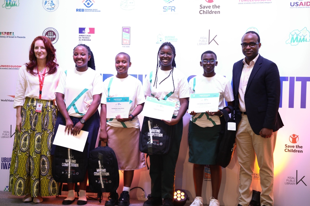 The Minister of State in charge of Primary and Secondary Education, Gaspard Twagirayezu poses for a photo with the overall winners in the upper secondary category during the awarding ceremony in Kigali on Saturday, June 3. All photos by Craish Bahizi