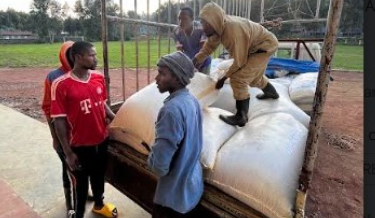 Workers offload some food stuff that will be distributed to residents affected by disasters in Western province in Nyabihu District on May 3. Courtesy