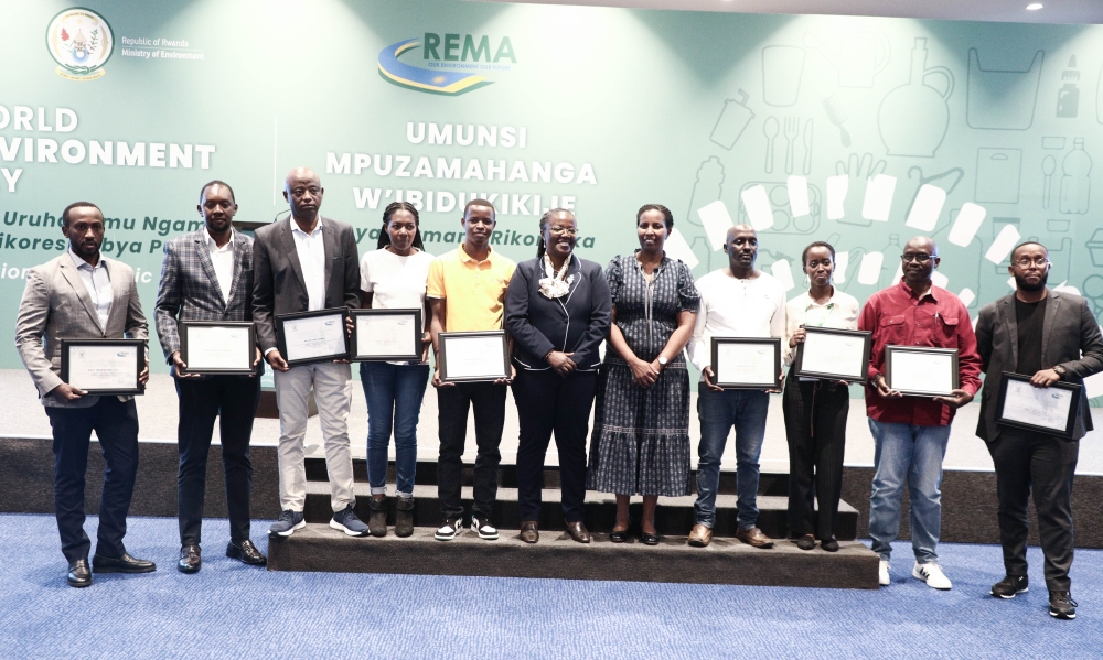 People representing entities that were awarded for their efforts to address plastic pollution through plastic waste management pose for a photo with Environment Minister Jeanne d&#039;Arc Mujawamariya (C), and the Director General, Rwanda Environment Management Authority (REMA), Juliet Kabera, on June 5, 2023, in Kigali. Photos by Craish Bahizi