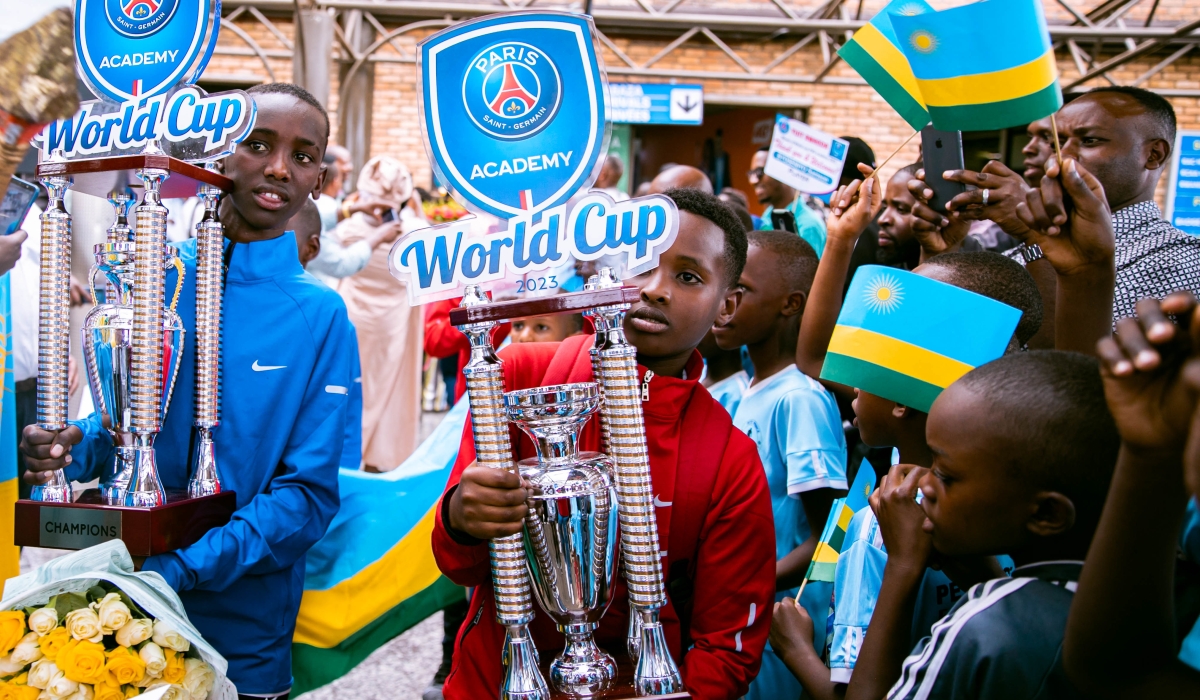 The U11 team captain, Samuel Shema (blue jacket) and the U13 team captain, Crispin Manzi Kanamugire (red jacket), display their trophies to a big number of fans soon after the squad’s arrival at Kigali International Airport. The PSG Academy Rwanda squad, in the U11 and U13 categories, returned home to a heroes’ welcome, on Wednesday, June 7. All photos by Christianne Murengerantwari